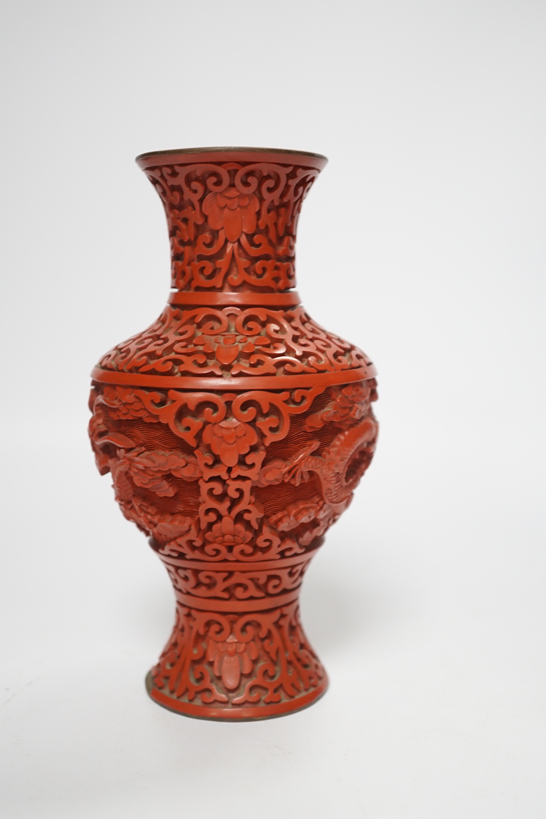 Three Chinese cinnabar lacquer items, a vase, an ashtray and a lidded box, vase 16.5cm